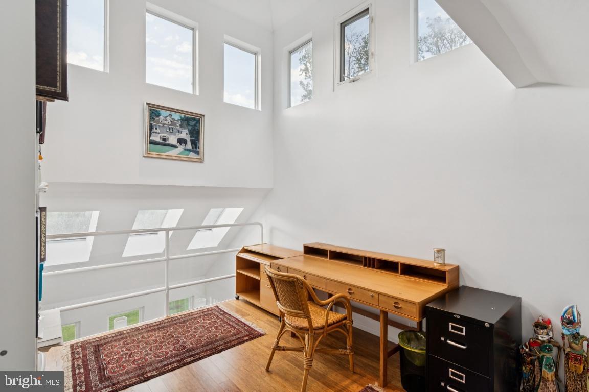 2102 South Road Baltimore, MD 21209 - Photo 16 of 37 a bedroom with a bed and a window