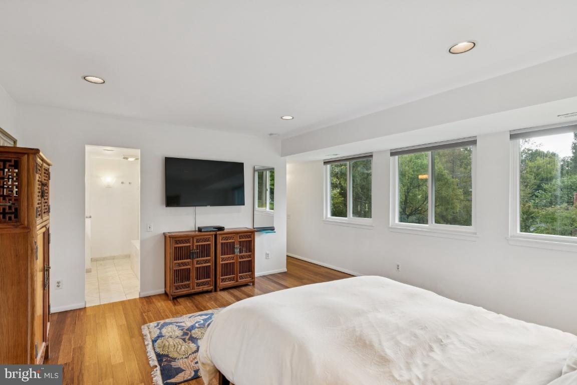 2102 South Road Baltimore, MD 21209 - Photo 22 of 37 a bedroom with furniture and a flat screen tv