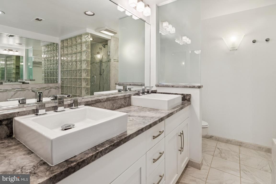 2102 South Road Baltimore, MD 21209 - Photo 23 of 37 a bathroom with a sink and a mirror