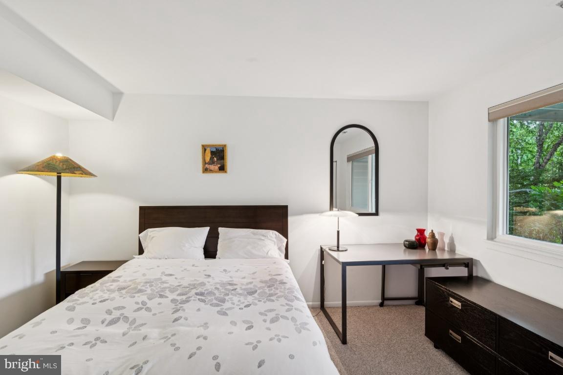 2102 South Road Baltimore, MD 21209 - Photo 27 of 37 a bedroom with a bed and a window