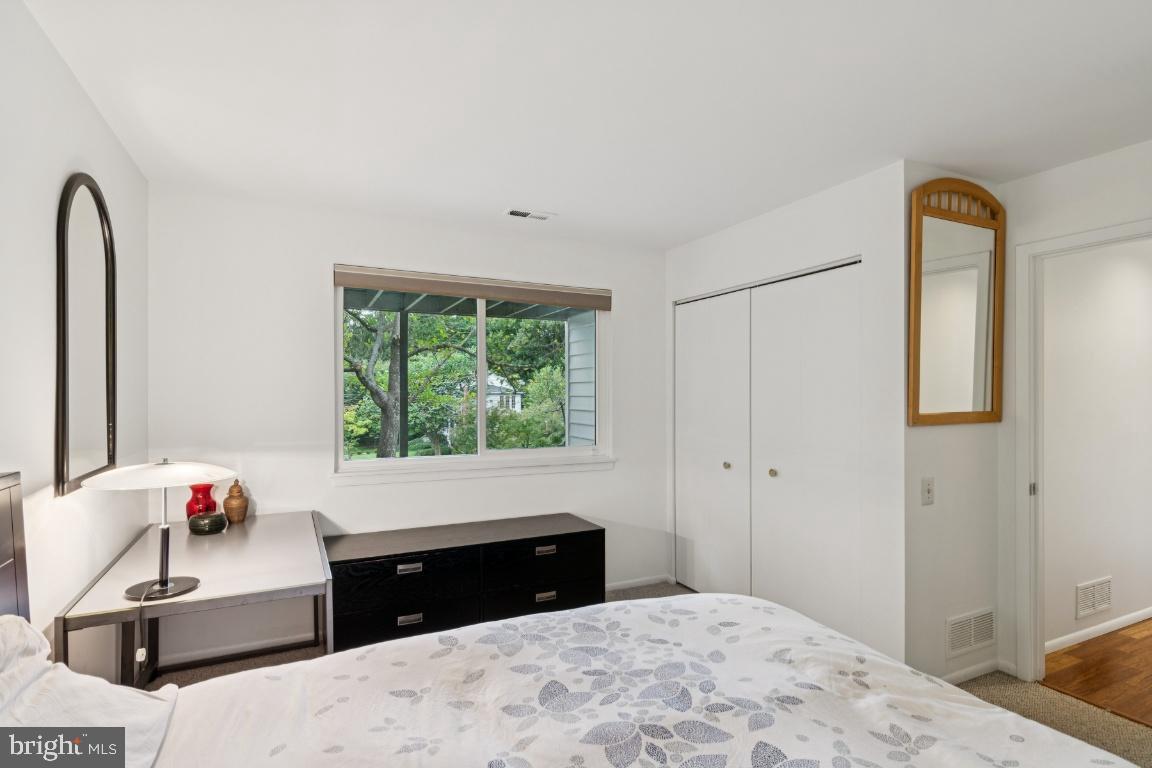 2102 South Road Baltimore, MD 21209 - Photo 28 of 37 a bedroom with a bed and a window