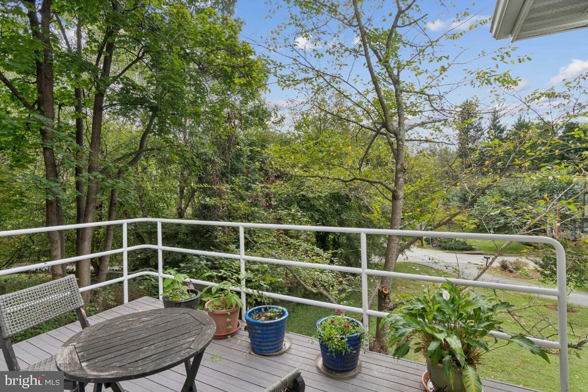 2102 South Road Baltimore, MD 21209 - Photo 30 of 37 a view of a chair and table on the deck