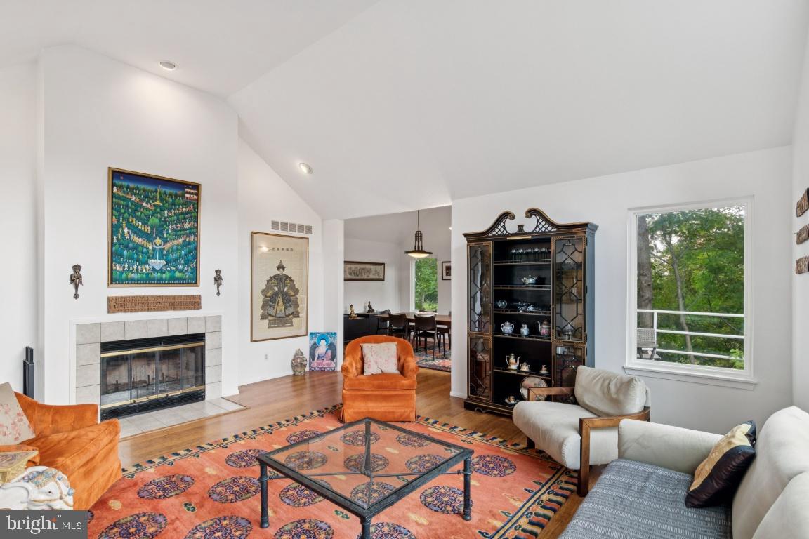2102 South Road Baltimore, MD 21209 - Photo 5 of 37 a living room with furniture a fireplace and bookshelf