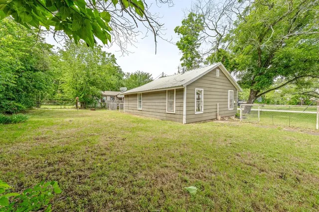 a view of outdoor space with deck and yard