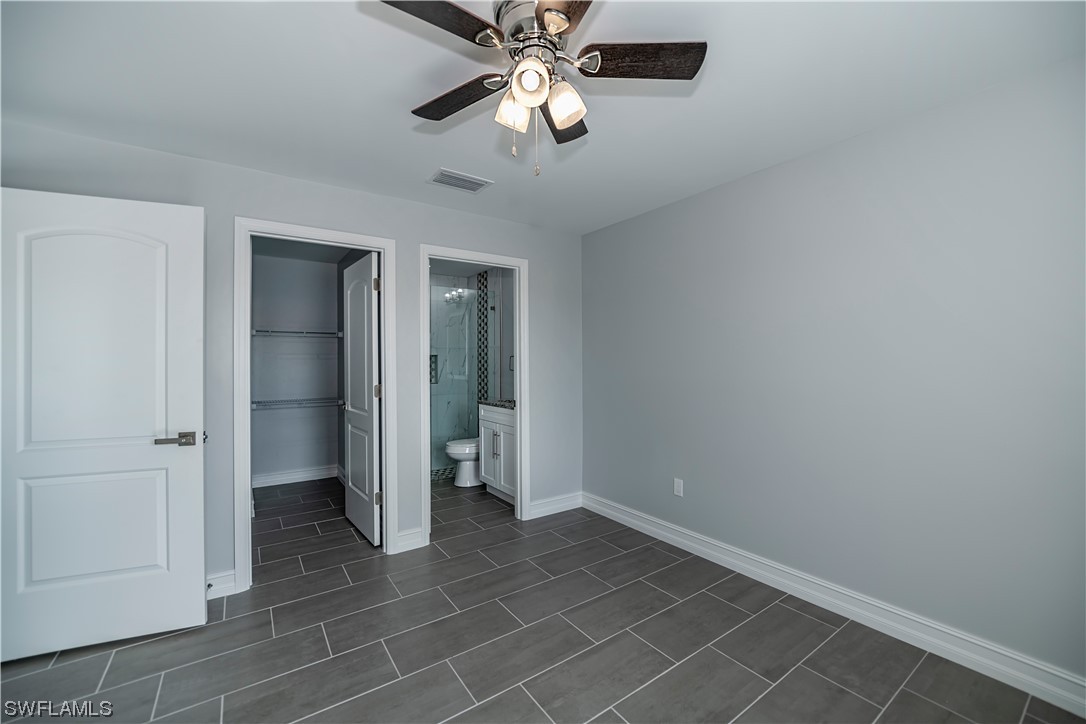 9024 Largo Circle LaBelle, FL 33935 - Photo 18 of 27 an empty room with closet and a chandelier fan