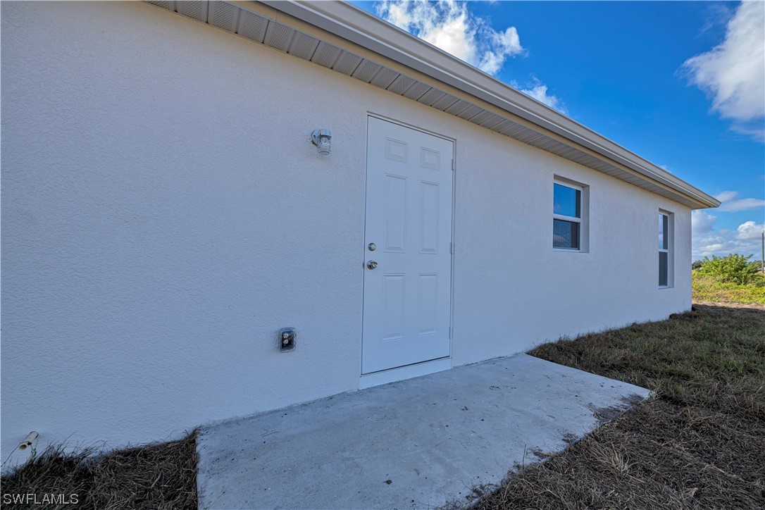 9024 Largo Circle LaBelle, FL 33935 - Photo 26 of 27 a view of backyard and hardwood