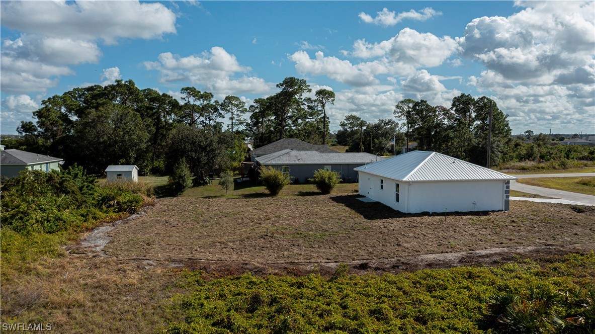 9024 Largo Circle LaBelle, FL 33935 - Photo 27 of 27 a house with trees in the background