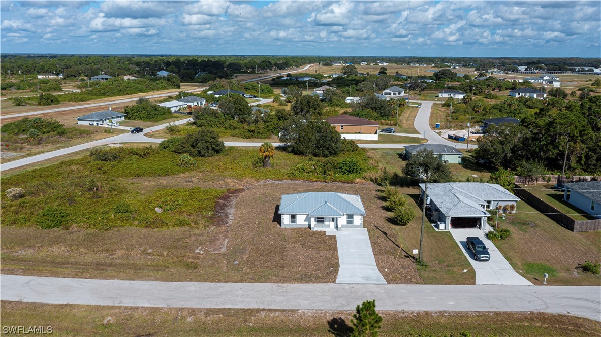 9024 Largo Circle LaBelle, FL 33935 - Photo 3 of 27 an aerial view of residential houses with outdoor space