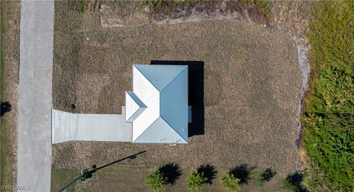 9024 Largo Circle LaBelle, FL 33935 - Photo 5 of 27 a brick house with a street