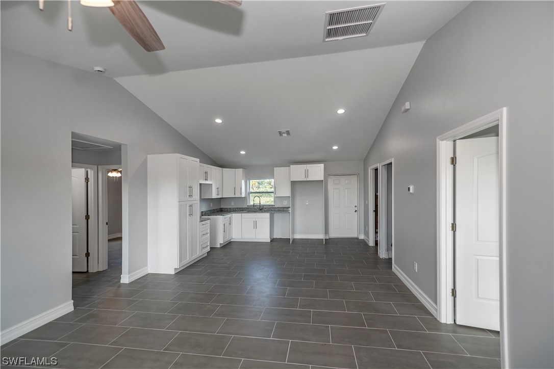 9024 Largo Circle LaBelle, FL 33935 - Photo 9 of 27 a view of a kitchen with a sink and a refrigerator