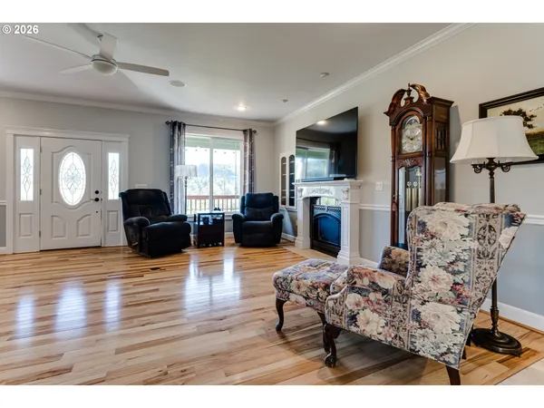 a living room with furniture fireplace and flat screen tv
