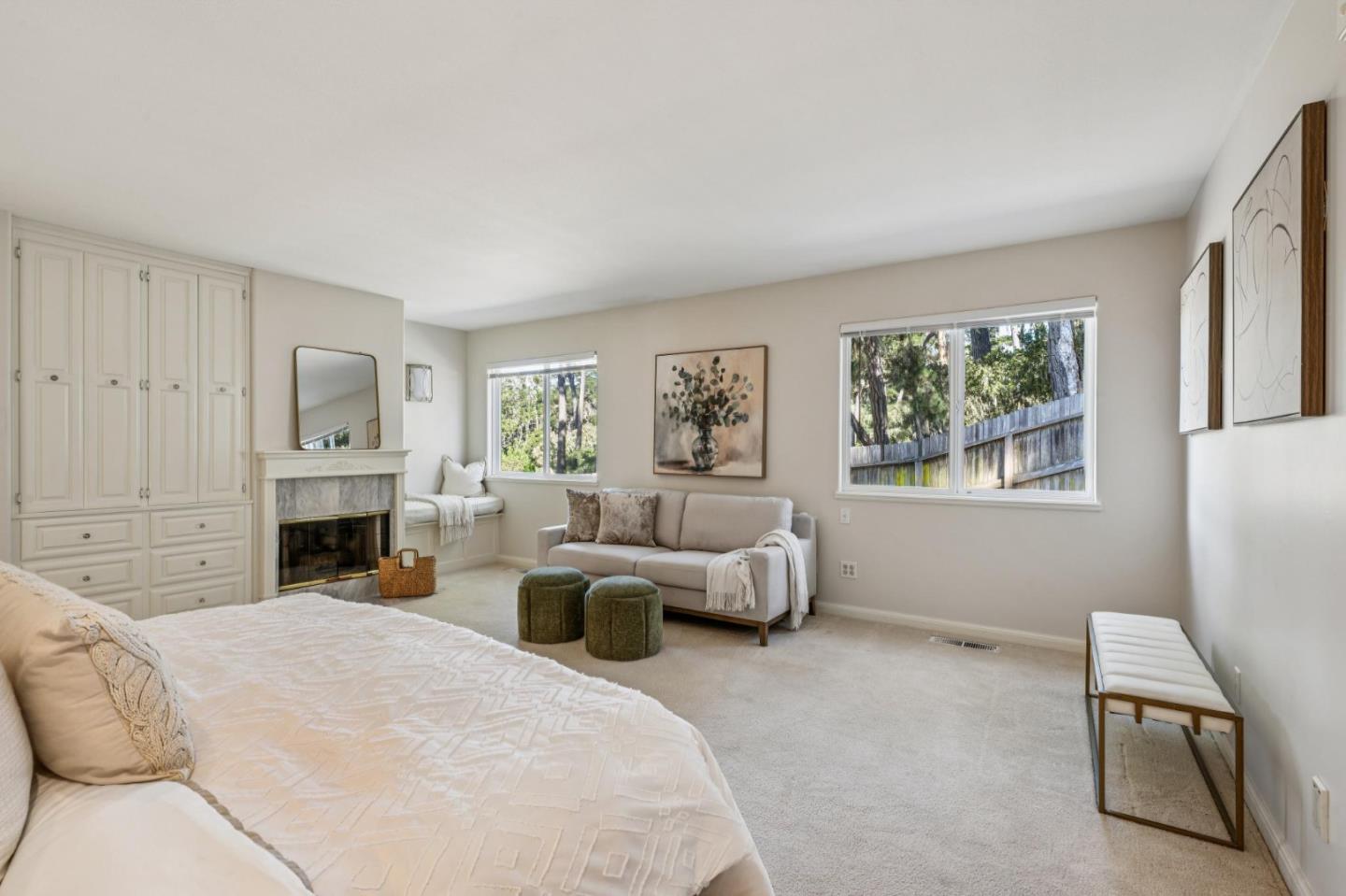 2905 Bird Rock Road Pebble Beach, CA 93953 - Photo 21 of 33 a bed room with furniture and a fireplace