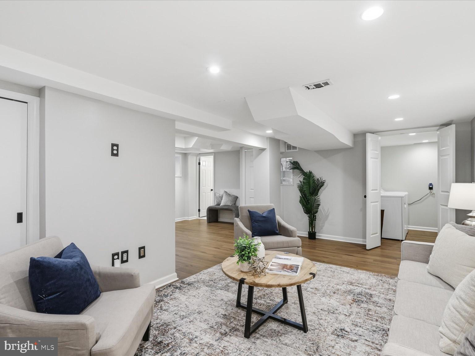 6437 Spring Terrace Falls Church, VA 22042 - Photo 25 of 42 a living room with furniture and wooden floor