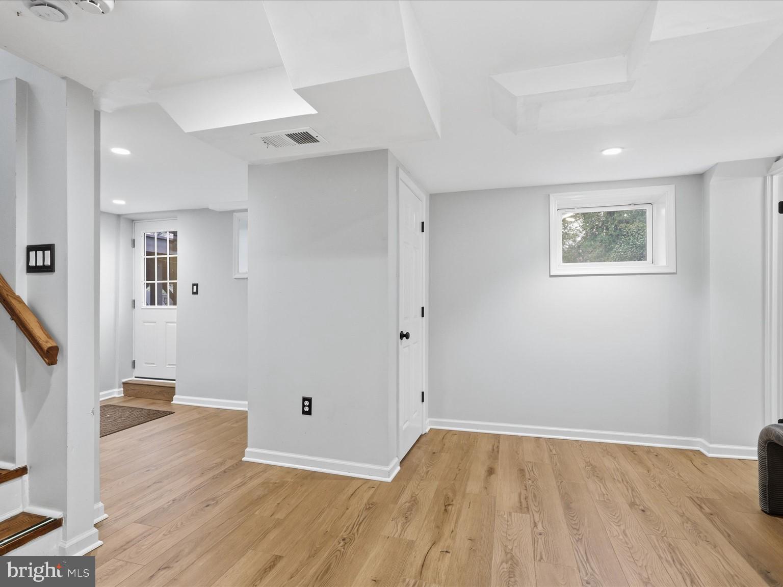 6437 Spring Terrace Falls Church, VA 22042 - Photo 27 of 42 a view of an empty room with wooden floor and a ceiling fan
