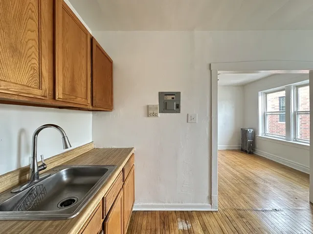 a kitchen with a sink and cabinets