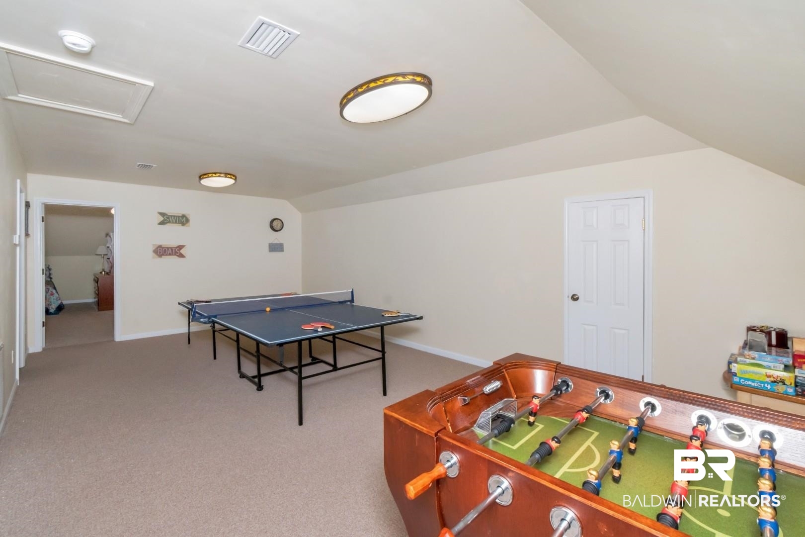 9905 Carnoustie Court Foley, AL 36535 - Photo 20 of 31 Playroom with attic access, light colored carpet, and lofted ceiling