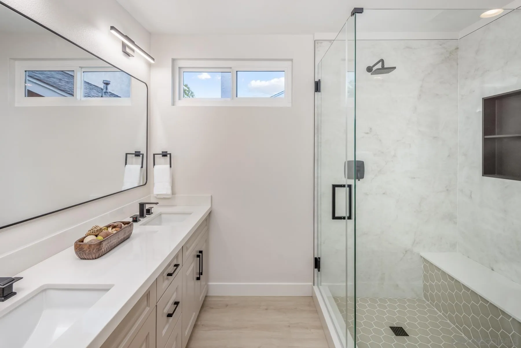 1999 Azure Way Encinitas, CA 92024 - Photo 13 of 27 a bathroom with a sink a shower and a mirror