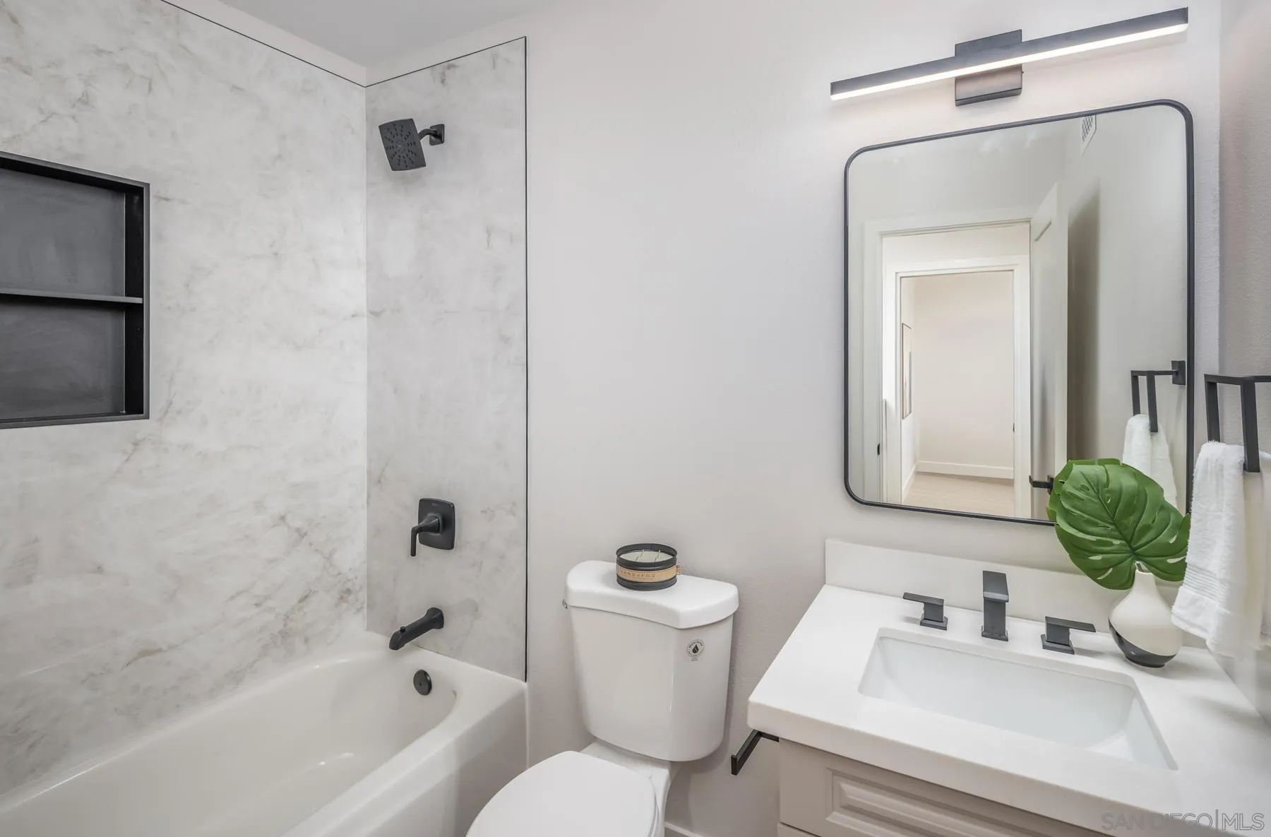 1999 Azure Way Encinitas, CA 92024 - Photo 14 of 27 a bathroom with a toilet a sink and bathtub