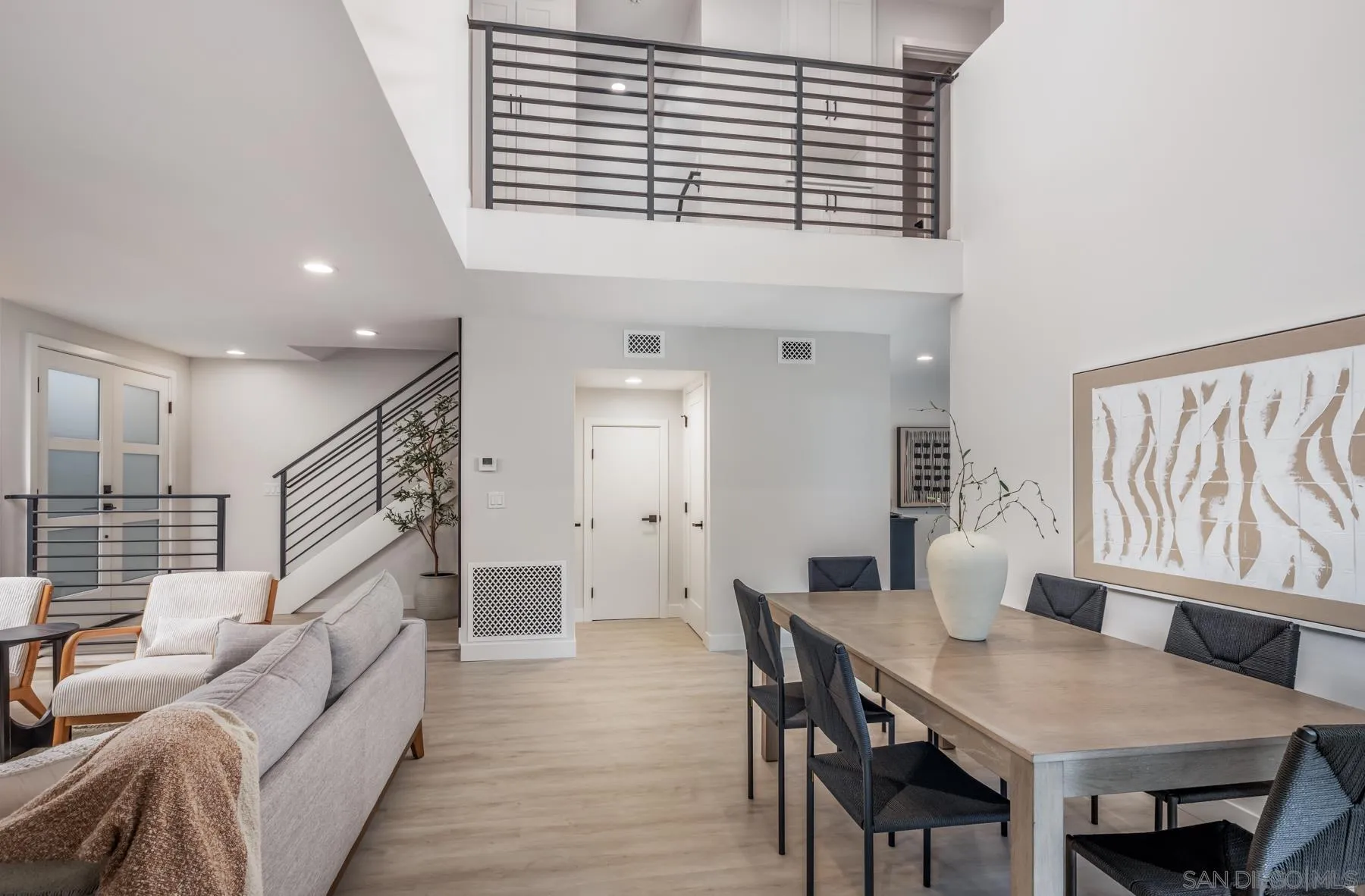 1999 Azure Way Encinitas, CA 92024 - Photo 16 of 27 a living room with furniture and a wooden floor