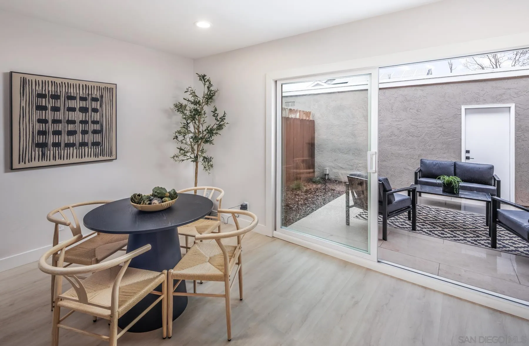 1999 Azure Way Encinitas, CA 92024 - Photo 22 of 27 a dining room with furniture and wooden floor
