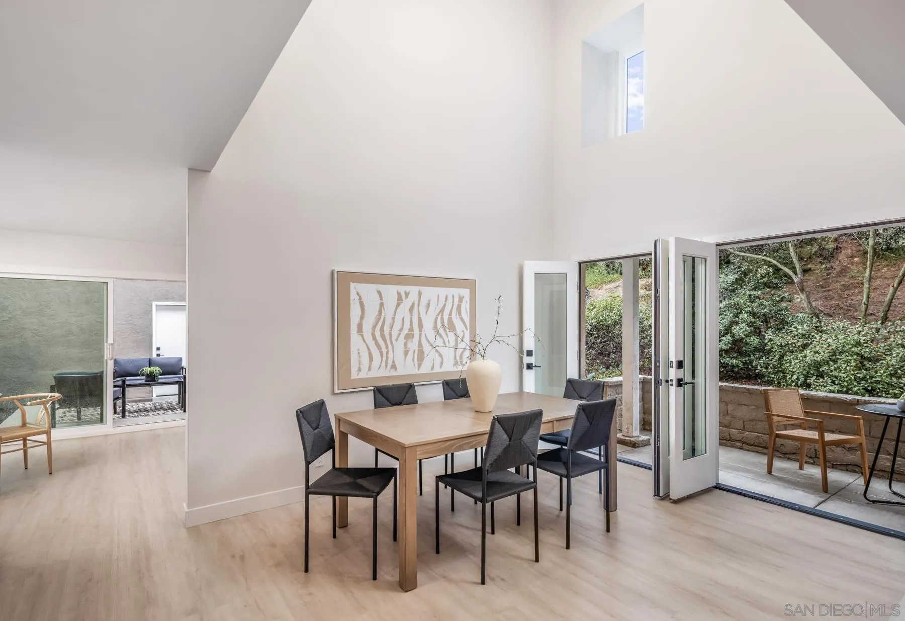 1999 Azure Way Encinitas, CA 92024 - Photo 24 of 27 a dining room with furniture window and wooden floor