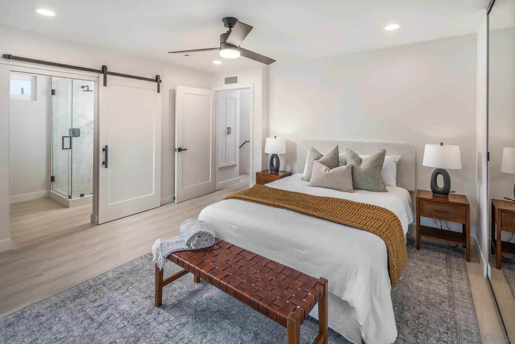 1999 Azure Way Encinitas, CA 92024 - Photo 9 of 27 a spacious bedroom with a bed and a table