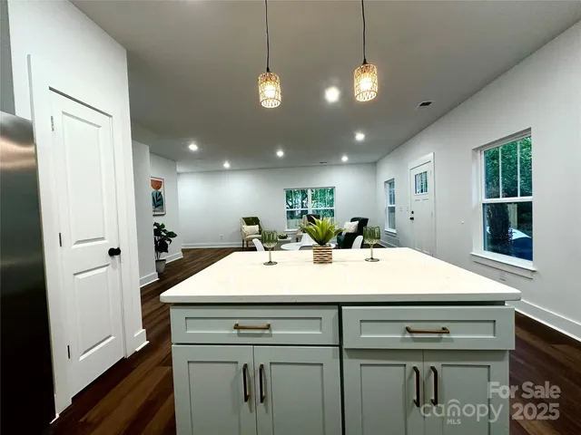 a view of a hallway with furniture