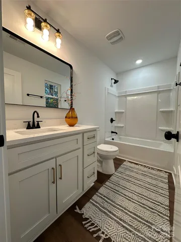 a bathroom with a sink and mirror