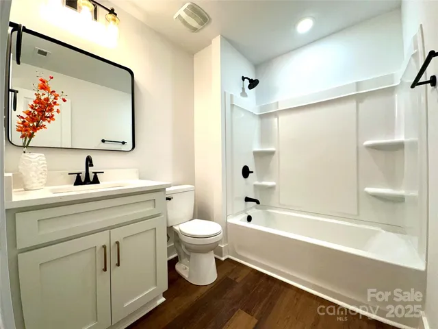 a bathroom with a sink a toilet and a bathtub