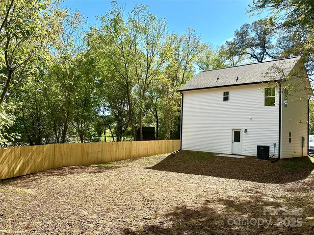 a house view with a backyard space