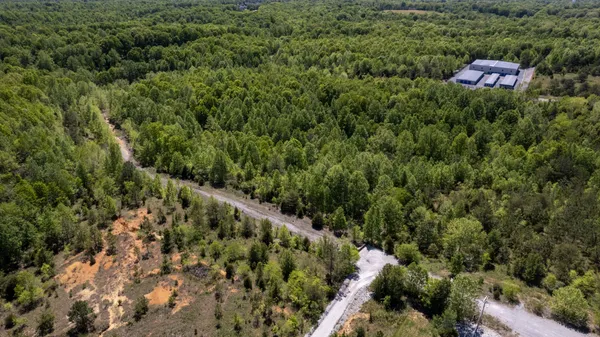 an aerial view of house with yard