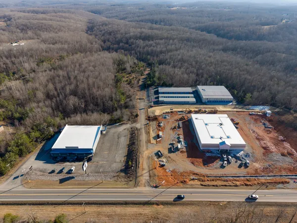 an aerial view of houses with yard