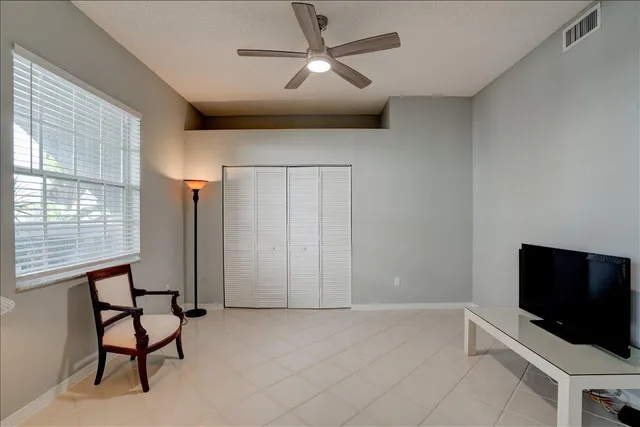 a view of a dining room with furniture and window
