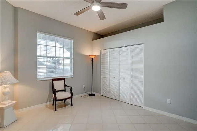 a view of a dining room with furniture and a window