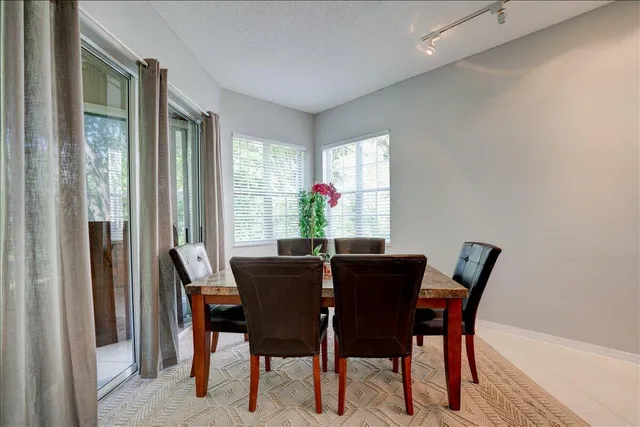 a kitchen with granite countertop a stove sink and cabinets