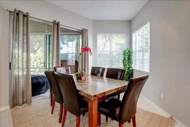 a kitchen with stainless steel appliances granite countertop a stove refrigerator sink and cabinets