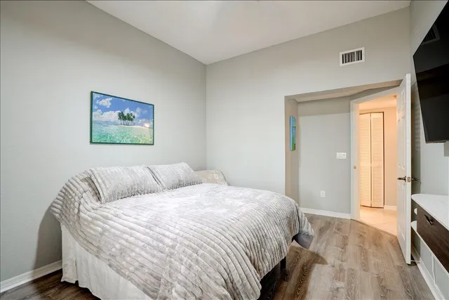 a bathroom with a sink a toilet and a large mirror