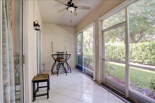 a view of a house with a yard porch and sitting area