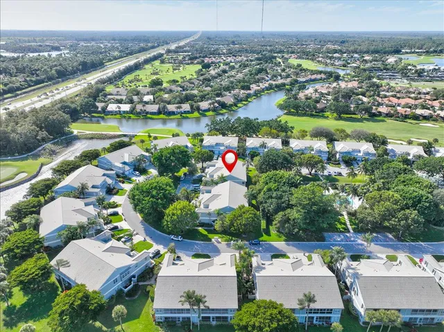 a bedroom with a bed and a mirror