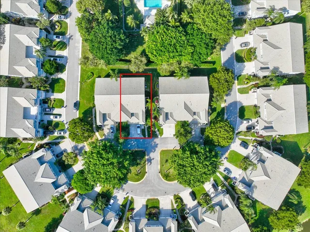 a dining room with furniture a chandelier and wooden floor