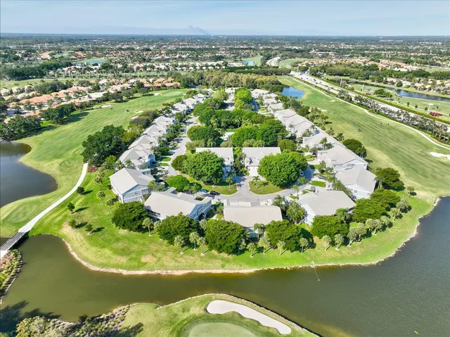 a view of a dining room with furniture and a potted plant
