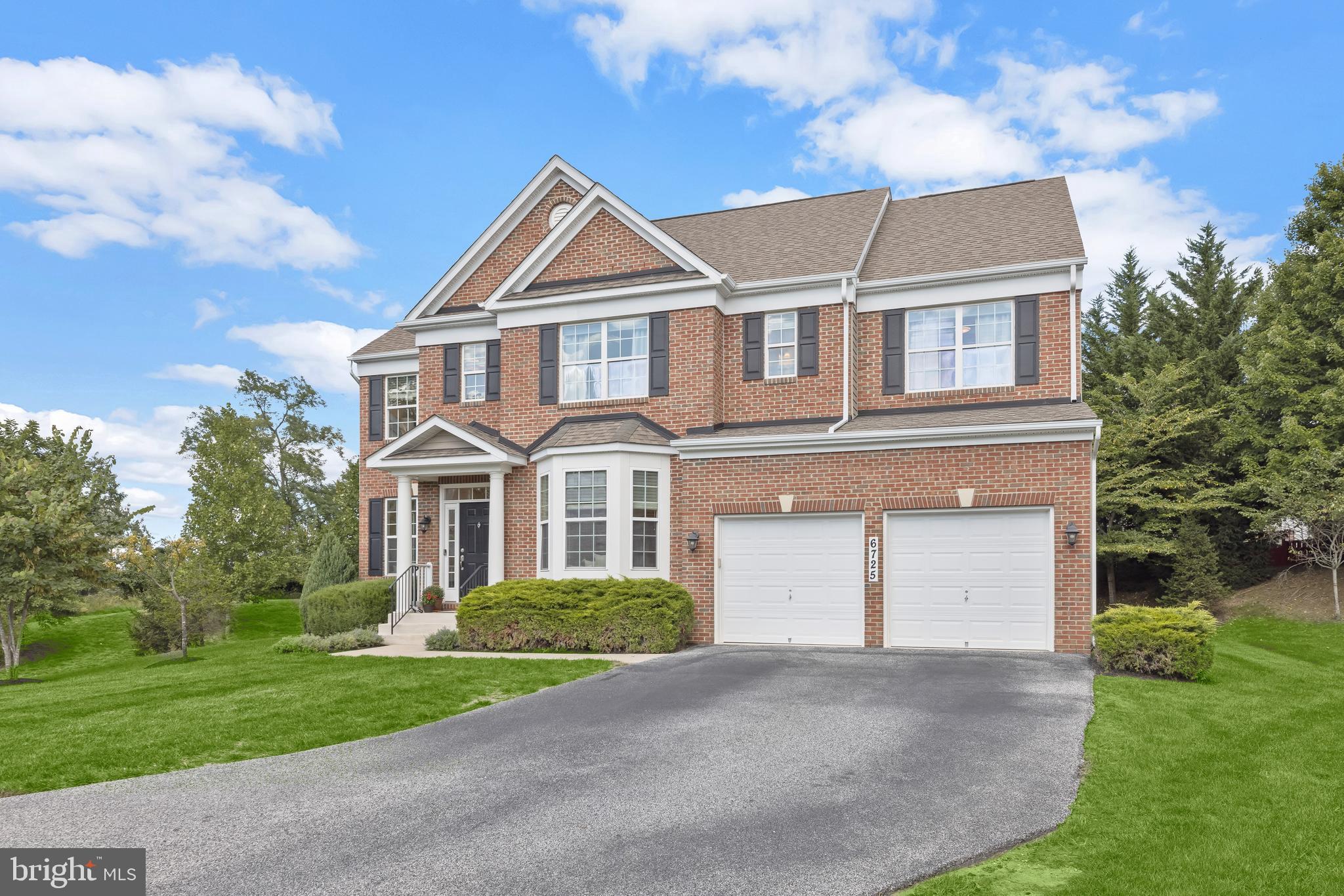 6725 Evanston Road Baltimore, MD 21209 - Photo 1 of 1 a front view of a house with a yard and garage