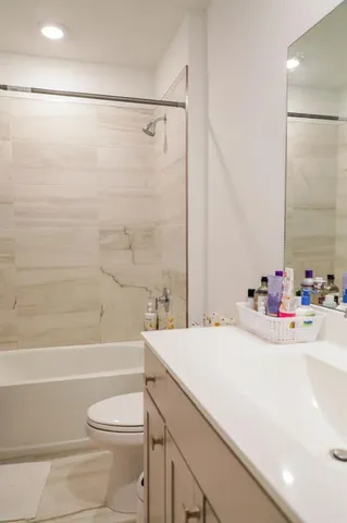 a bathroom with a sink a toilet and a bathtub