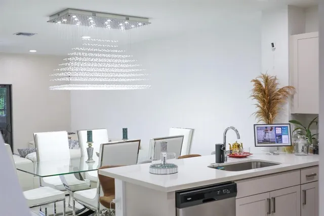 a kitchen with a sink and a refrigerator