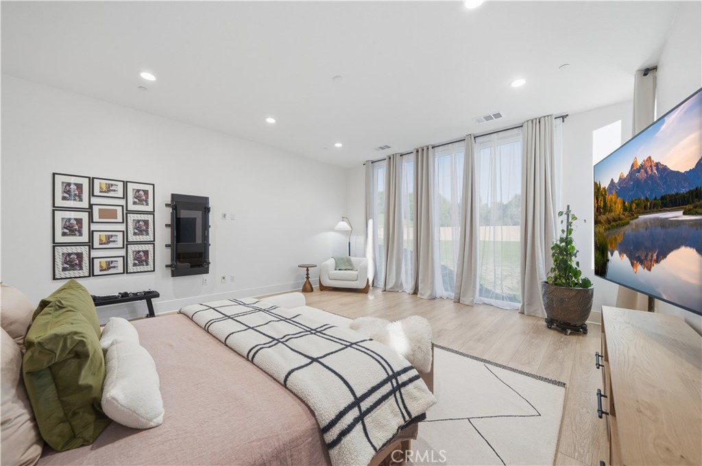 39788 Larkspur Terrace Temecula, CA 92591 - Photo 28 of 75 a bedroom with a large bed and a large window