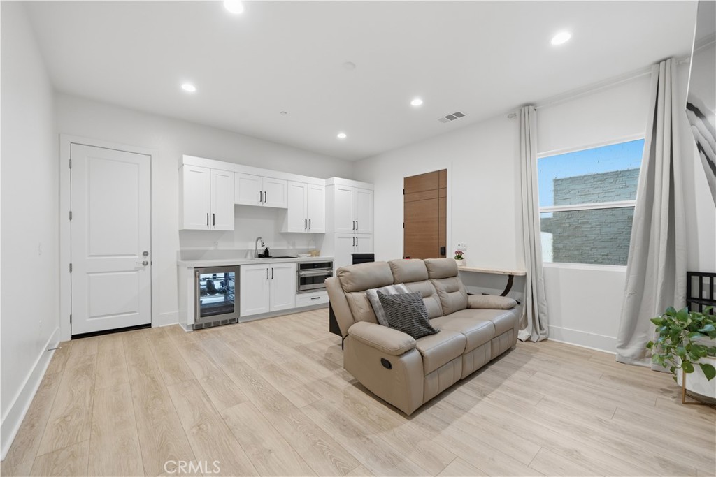 39788 Larkspur Terrace Temecula, CA 92591 - Photo 35 of 75 a living room with furniture and a large window