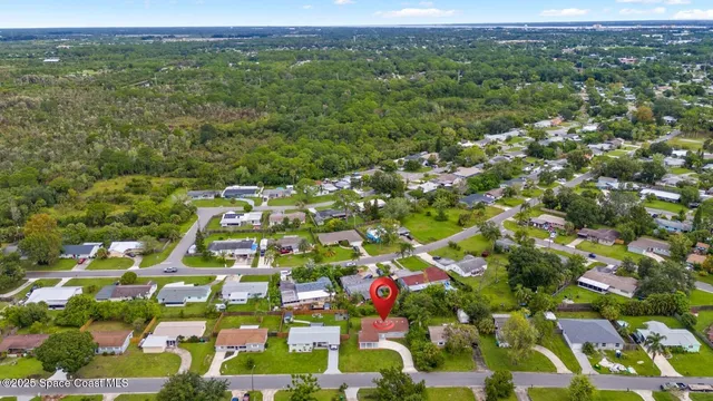 a view of a big yard with lots of green space