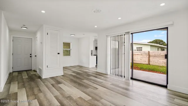 a bedroom with bed and window
