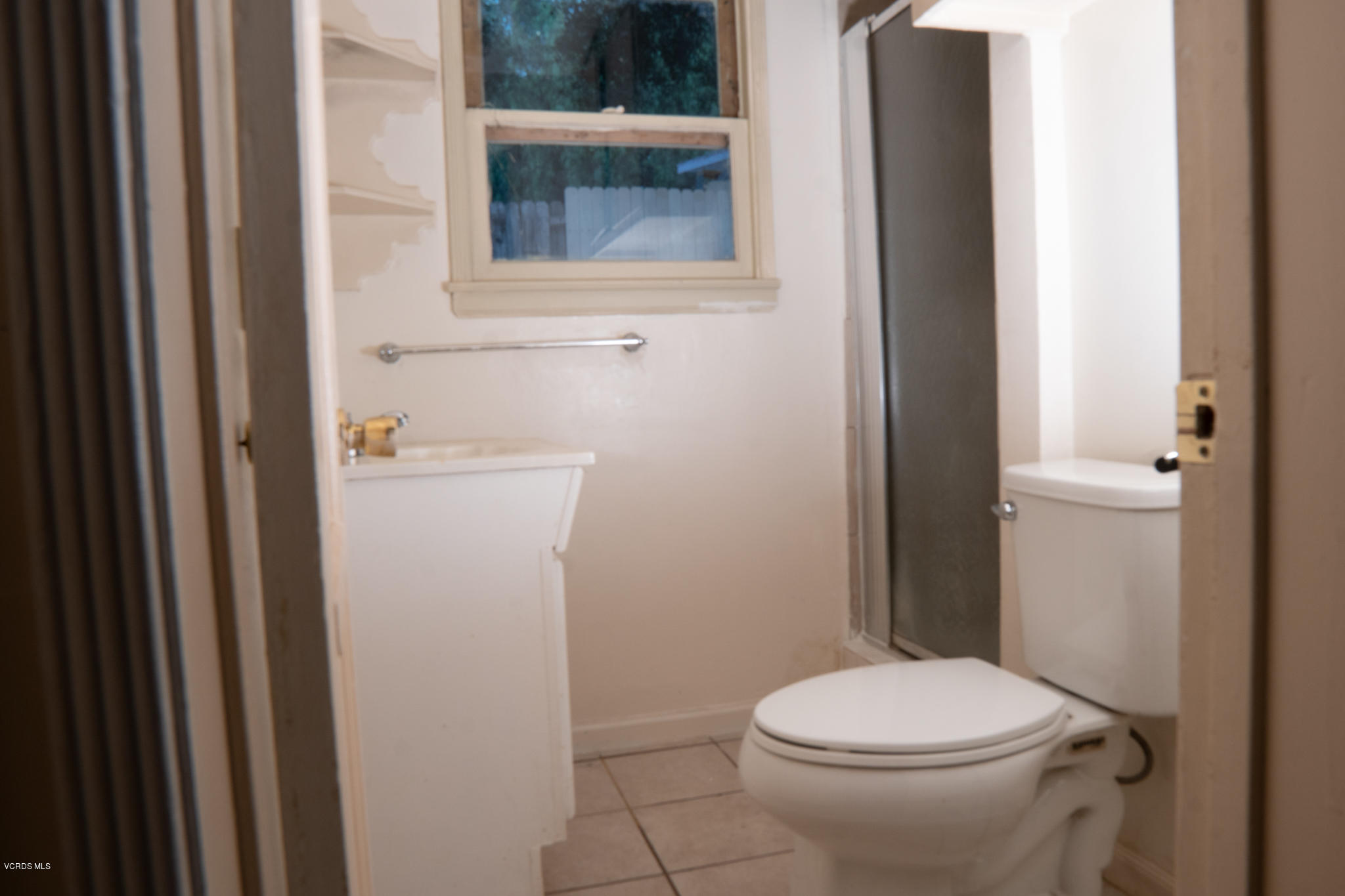246 Valley Road Oak View, CA 93022 - Photo 22 of 34 a white toilet sitting next to a bathroom sink