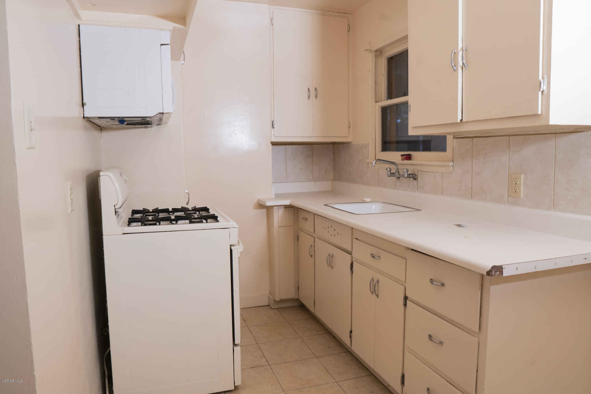 246 Valley Road Oak View, CA 93022 - Photo 25 of 34 a kitchen with sink cabinets and microwave